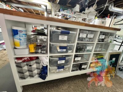 Those are random things. Bins holding ethernet cords, HDMI cords, power strips and some accessories for power tools as well.
Ikea 2x4 on stand. Using LAGKAPTEN tabletop (63.5x23.5)